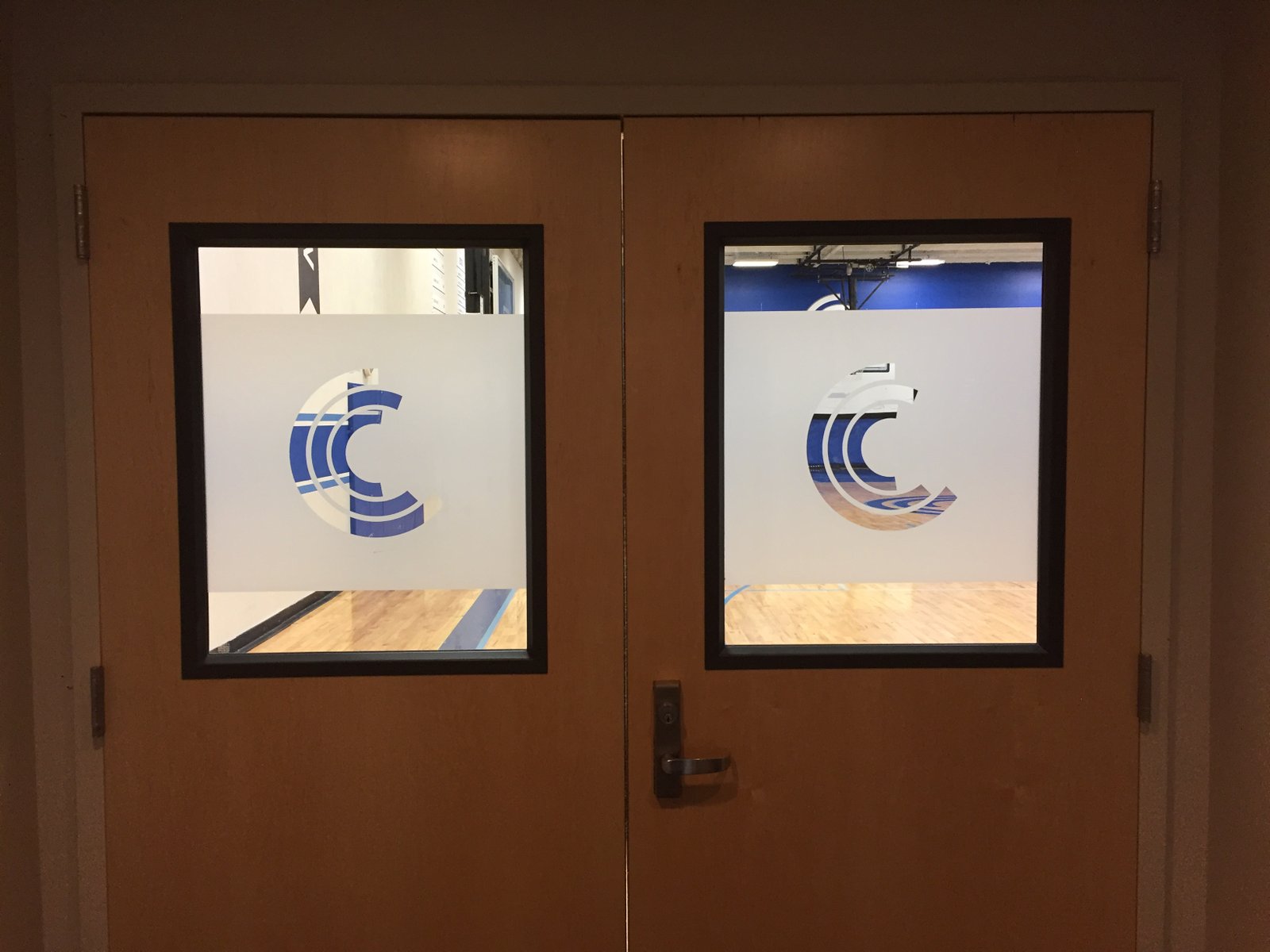Frosted glass door graphics on gymnasium doors